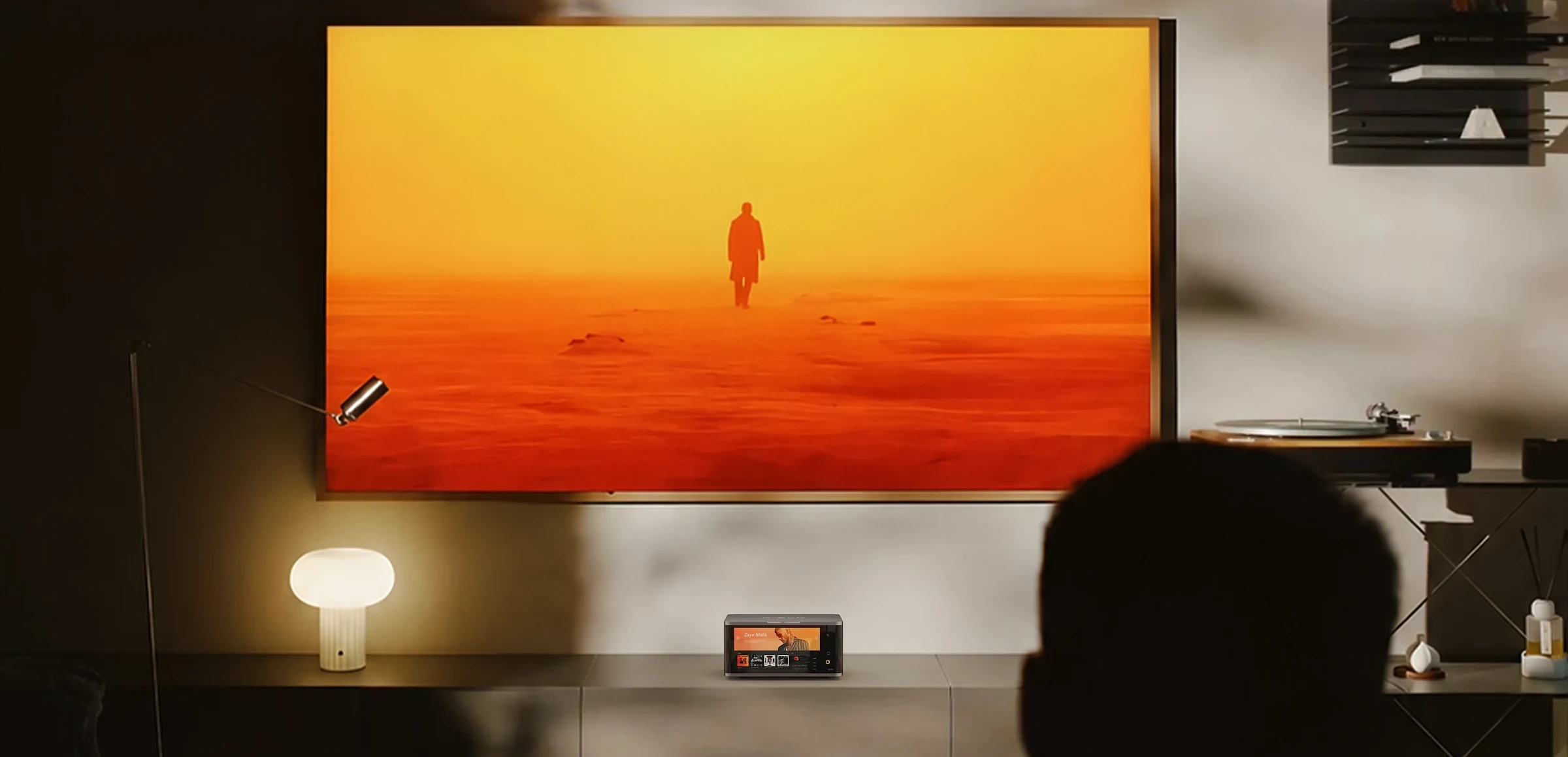 AIO70 in a cinematic living room entertainment space